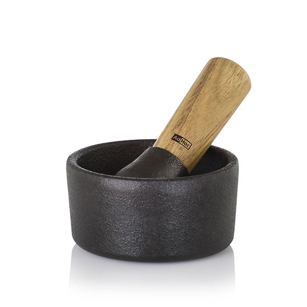 Mortier et pilon en fonte et bois d