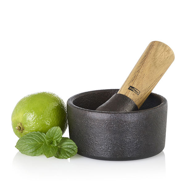Mortier et pilon en fonte et bois d