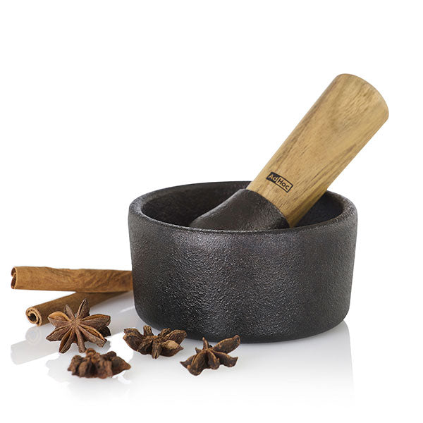 Mortier et pilon en fonte et bois d